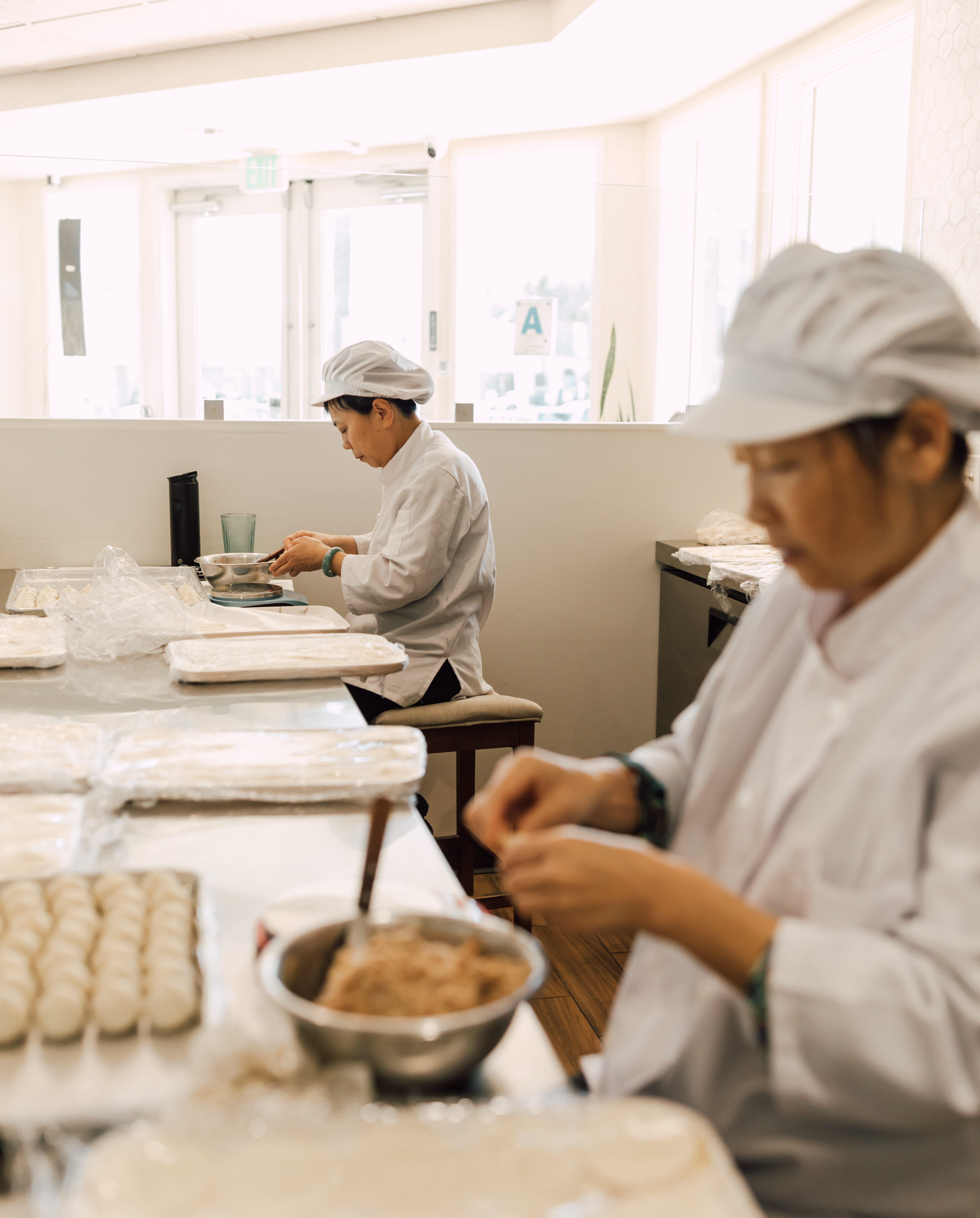 Dumpling aunties handcrafting dumplings